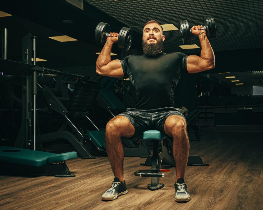 muscular-young-man-lifting-weights-in-a-dark-gym-1.jpg muscular-young-man-lifting-weights-in-a-dark-gym-1.jpg